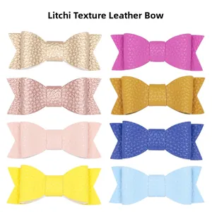 Close-up of litchi pattern leather bows in eight colors for handmade hair accessories
