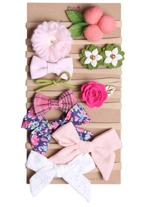 Detail von 10er-Pack Baby-Stirnbändern mit Blumenmustern und weichen Stoffschleifen