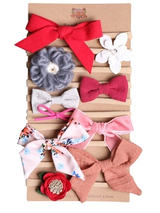 Close-up of 10-piece baby headband set with floral and bow designs on nylon bands