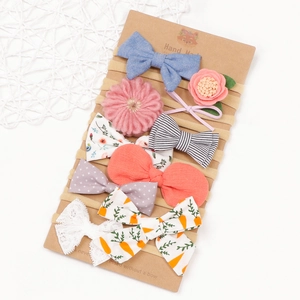 Set di 7 fasce per neonati con fiocchi stampati e fiori su morbide fasce elastiche in nylon