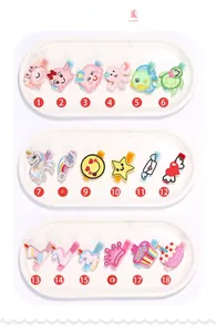Detalle del set de 18 horquillas bordadas para niños con varios patrones de animales