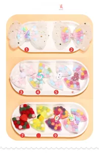 Detail of 10-piece kids bow hair clips with mesh ribbon, colorful pom-poms and resin charms