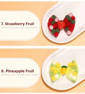 Detail of sweet strawberry and pineapple mesh bow hair clips with colorful pom poms