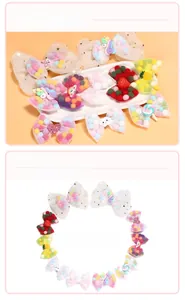 Detail of colorful tulle bow hair clips with cute cartoon resin charms and plush balls