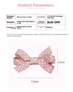 Detail view of pink polka dot ribbon bow clip with measurements 5.5cm by 2.5cm