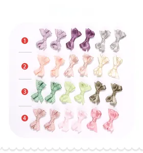 Close-up of assorted grosgrain hair bows in polka dots and satin textures for kids