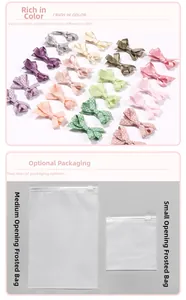Detail view of handmade bow hair clips in various colors with frosted zipper bag packaging