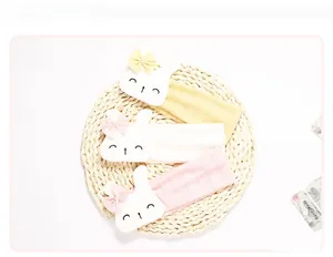 Detailed view of breathable cotton baby headbands with cute rabbit and bow accents