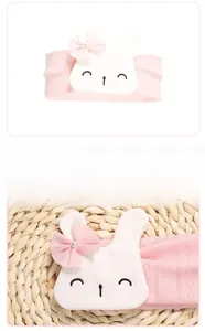 Detailed close-up of pink breathable knitted baby headband with rabbit patch and pearl lace bow