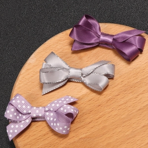 Three-piece set of cute bow hair clips with purple satin and polka dot ribbon patterns