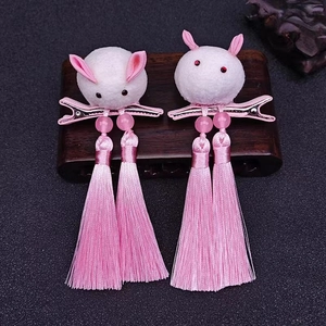 Traditional Chinese rabbit tassel hair clips for girls with pink beads and plush details