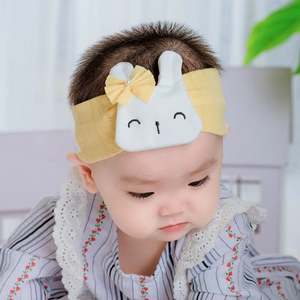 Yellow breathable cotton baby headband with cute rabbit ears and pearl bow detail