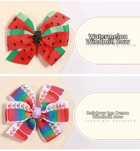 Détail de barrettes faites main avec motifs pastèque et glace arc-en-ciel pour enfants