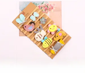 Close-up of 10-piece baby nylon headbands with embroidered animal and candy motifs