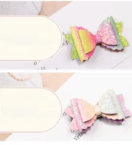 Close-up of glitter hair clips with vibrant gradient sequins and wavy edge design