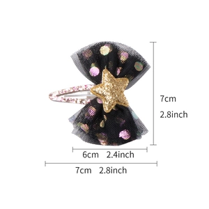 Black mesh bow hair clip with gold star and polka dots, showing 7cm x 7cm dimensions