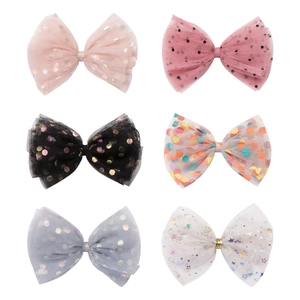 Set of six colorful polka dot tulle bow hair clips with glitter star patterns for girls