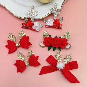 Lot de pinces à cheveux bois de renne de Noël avec fleurs rouges et paillettes sur rose