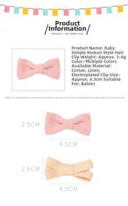 Detail view of pink and beige cotton linen bow hair clips with metal base for babies