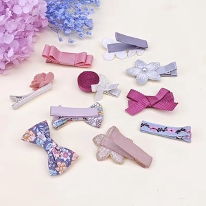 10pcs set of floral ribbon bows and pearl hair clips for girls in pastel purple and pink colors