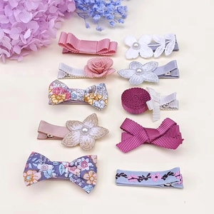 Detailed set of 10 floral hair clips with grosgrain bows and pearls for girls