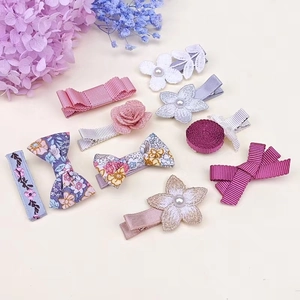 Detailed set of 10 floral hair clips with lace flowers, ribbons, and pearls for girls