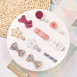 Set of 10 floral bow and pearl hair clips for girls with ribbon and embroidery detail