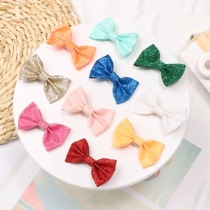 Set di dieci fermagli per capelli con fiocchi glitterati per bambine in vari colori