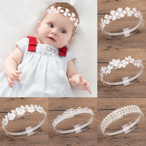 Elegant white lace baby headbands with floral patterns and pearl rhinestone accents
