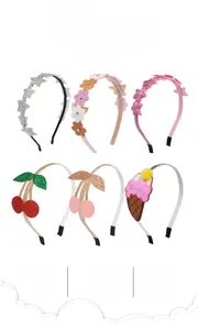 Detail view of children's glitter headbands featuring star and ice cream motifs