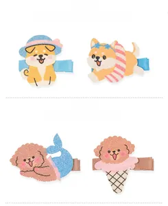 Detalle de pinzas para el pelo Shiba Inu y Teddy de tela brillante con cola de sirena y helado
