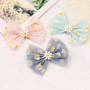 Set di tre fermagli per capelli con fiocchi in tulle e stampe di margherite per bimbe
