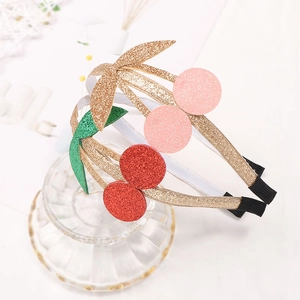 Glittery gold headbands with red and pink cherry ornaments for girls, set of 2
