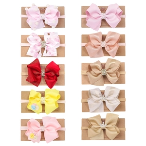 Lot de 10 bandeaux bébé avec nœuds, motifs floraux, perles et détails couronne