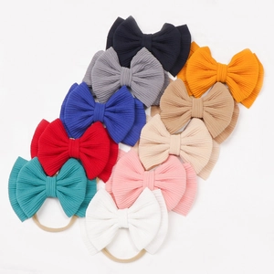 Set of 10 colorful baby oversized bow headbands made of soft elastic nylon fabric