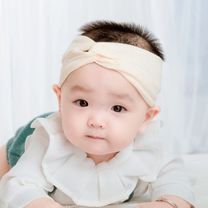 Sweet cream white knit twist knot baby headband made of elastic ribbed fabric material