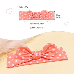 Bandeau bébé à pois avec nœud incluant le guide des tailles pour bébés de 0-24 mois