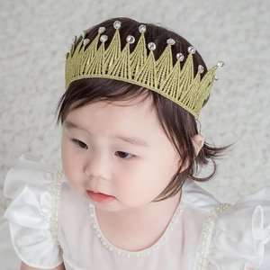 Golden lace crown headband for infants featuring sparkling rhinestones and elastic design