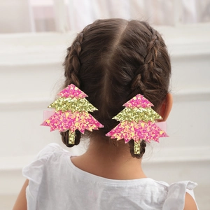 Barrettes à cheveux sapin de Noël à paillettes roses et dorées sur une coiffure