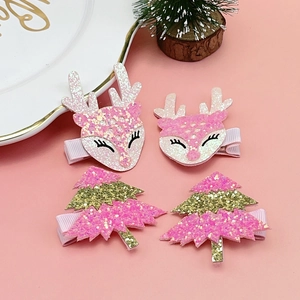 Détail de barrettes de Noël scintillantes renne et sapin rose pour enfants avec doublure