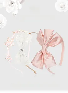 Detailed view of kids 3pcs headband set with pink satin bow and glitter star hair hoops