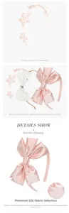 Detail of pink silk bow headband and glitter star hair accessory for girls