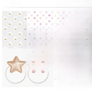 Detail of pink and gold sequin star hair ties with elastic silver cord for girls