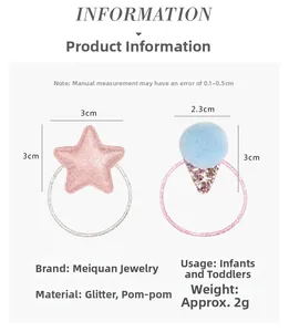 Detail view of pink glitter star and blue pom pom hair ties for infants and toddlers