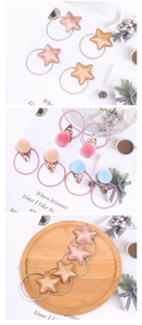 Close-up of star and ice cream hair ties with sequins and soft plush pom poms for girls