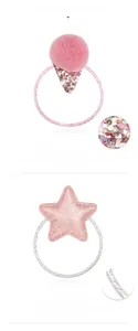 Detail of pink pompom and sequin star hair ties with high elasticity glitter bands