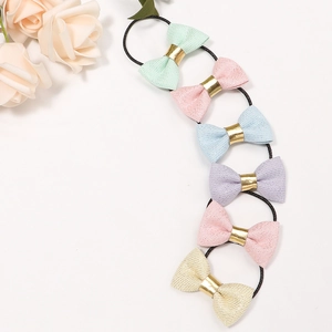 Set of 6 glitter bow elastic hair ties for toddlers in pastel colors with black bands
