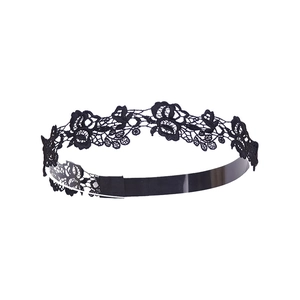 Detailed view of the intricate black lace floral pattern on this handmade headband