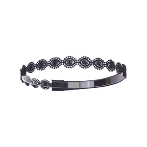 Detailed close-up of a black hollow lace headband with intricate floral embroidery patterns