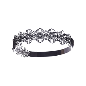 Detail view of black hollow lace headband with floral embroidery and elastic band